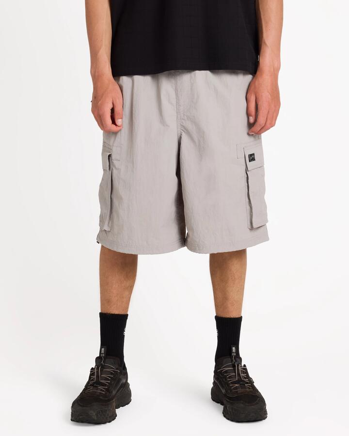 Image of a model wearing Shorts. Product name - Billabong Mens Spec 73 Cargo 23" Shorts Ash in Ash colour by brand - Billabong