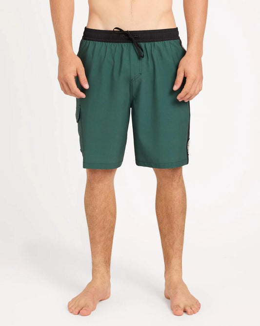 Image of a model wearing Shorts. Product name - Quiksilver Mens Battler 19" Volley Shorts Forest in Forest colour by brand - Quiksilver