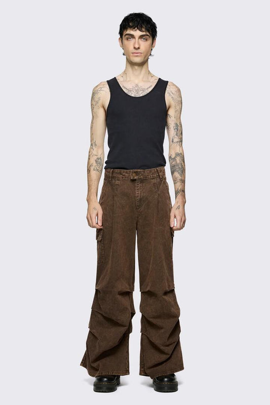Image of a model wearing Pants. Product name - Behind The Blinds Baggy Cargo in Brown colour by brand - Black Friday