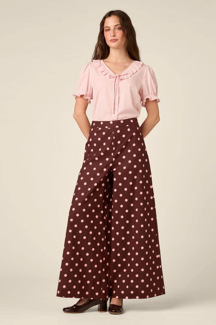 Image of a model wearing Pants. Product name - Mia Polka Dot Pant in Chocolate colour by brand - Princess Highway