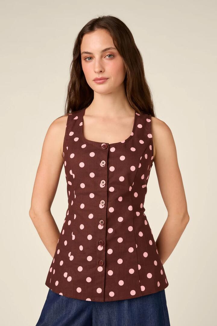 Image of a model wearing Tops. Product name - Mia Polka Dot Button Down Top in Chocolate colour by brand - Princess Highway