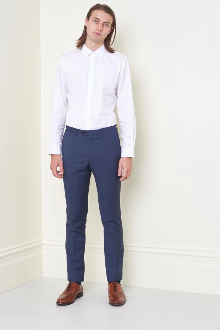 Image of a model wearing Pants. Product name - Prince Of Wales Mod Pant in Grey Check colour by brand - Jack London