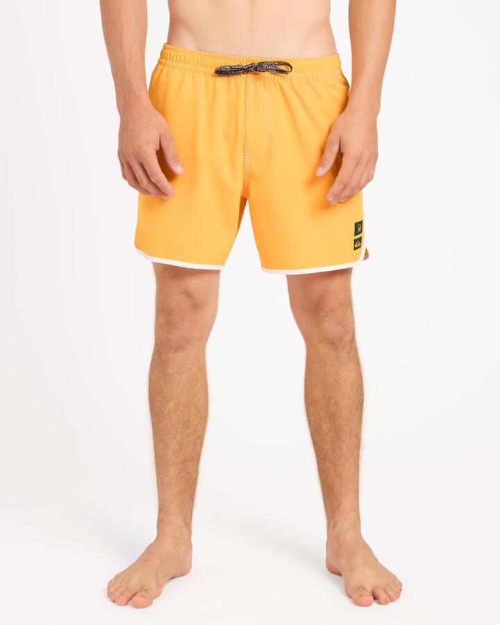 Image of a model wearing Shorts. Product name - Quiksilver Mens Bob Marley Scallop 16" Volley Shorts Radiant Yellow in Radiant Yellow colour by brand - Quiksilver