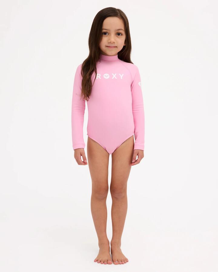 Image of a model wearing Tops. Product name - Roxy Girls 2-7 Long Sleeve Heater Rash Vest M Pink in M Pink colour by brand - Roxy