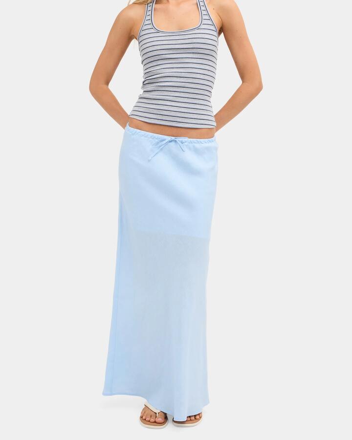 Image of a model wearing Skirts. Product name - Nunui Womens Lyric Linen Maxi Skirt Dusty Blue in Dusty Blue colour by brand - Nunui