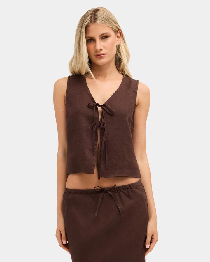 Image of a model wearing Tops. Product name - Nunui Womens Layton Linen Tank Top Chocolate 5 in Chocolate 5 colour by brand - Nunui