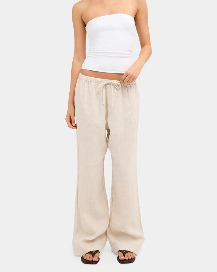 Image of a model wearing Pants. Product name - Nunui Womens Lynxley Linen Elastic Waist Pants Natural 3 in Natural 3 colour by brand - Nunui
