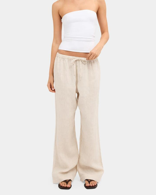 Image of a model wearing Pants. Product name - Nunui Womens Lynxley Linen Elastic Waist Pants Natural 3 in Natural 3 colour by brand - Nunui