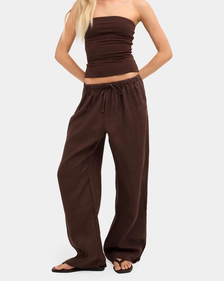 Image of a model wearing Pants. Product name - Nunui Womens Lynxley Linen Elastic Waist Pants Chocolate 5 in Chocolate 5 colour by brand - Nunui