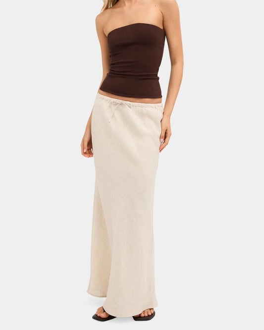 Image of a model wearing Skirts. Product name - Nunui Womens Lyric Linen Maxi Skirt Natural 3 in Natural 3 colour by brand - Nunui