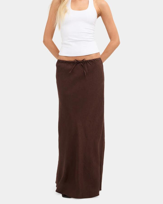 Image of a model wearing Skirts. Product name - Nunui Womens Lyric Linen Maxi Skirt Chocolate 5 in Chocolate 5 colour by brand - Nunui