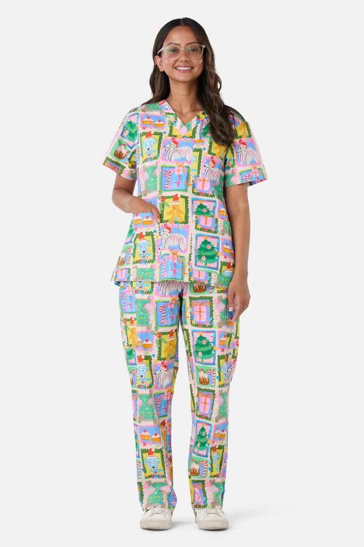 Image of a model wearing Uniforms & Workwear. Product name - Holiday Pups Scrub Set in Pink colour by brand - Scrubs With Love