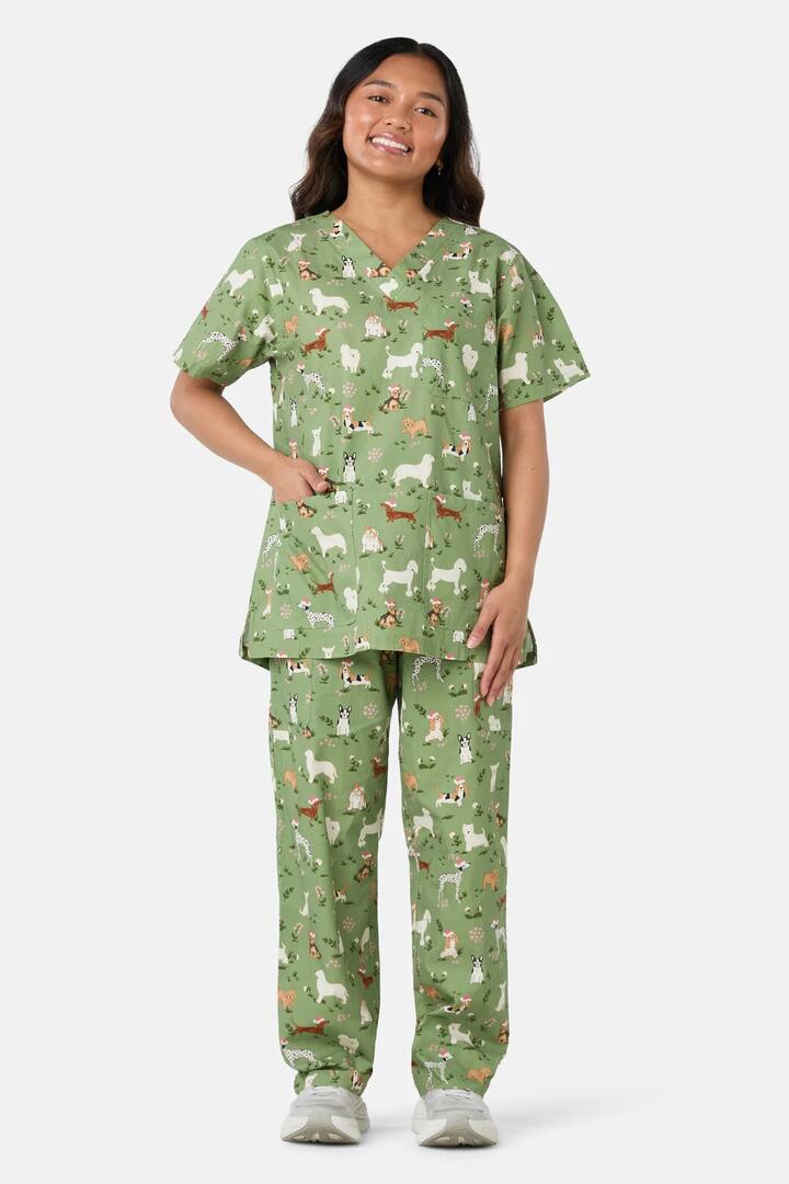 Image of a model wearing Uniforms & Workwear. Product name - Christmas Dogs Scrub Set in Green colour by brand - Scrubs With Love