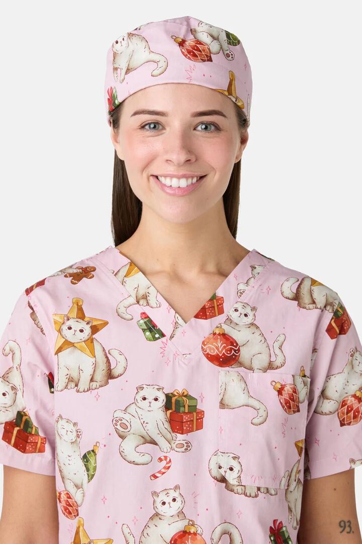 Image of a model wearing Uniforms & Workwear. Product name - Gift Cats Scrub Hat in Pink colour by brand - Scrubs With Love