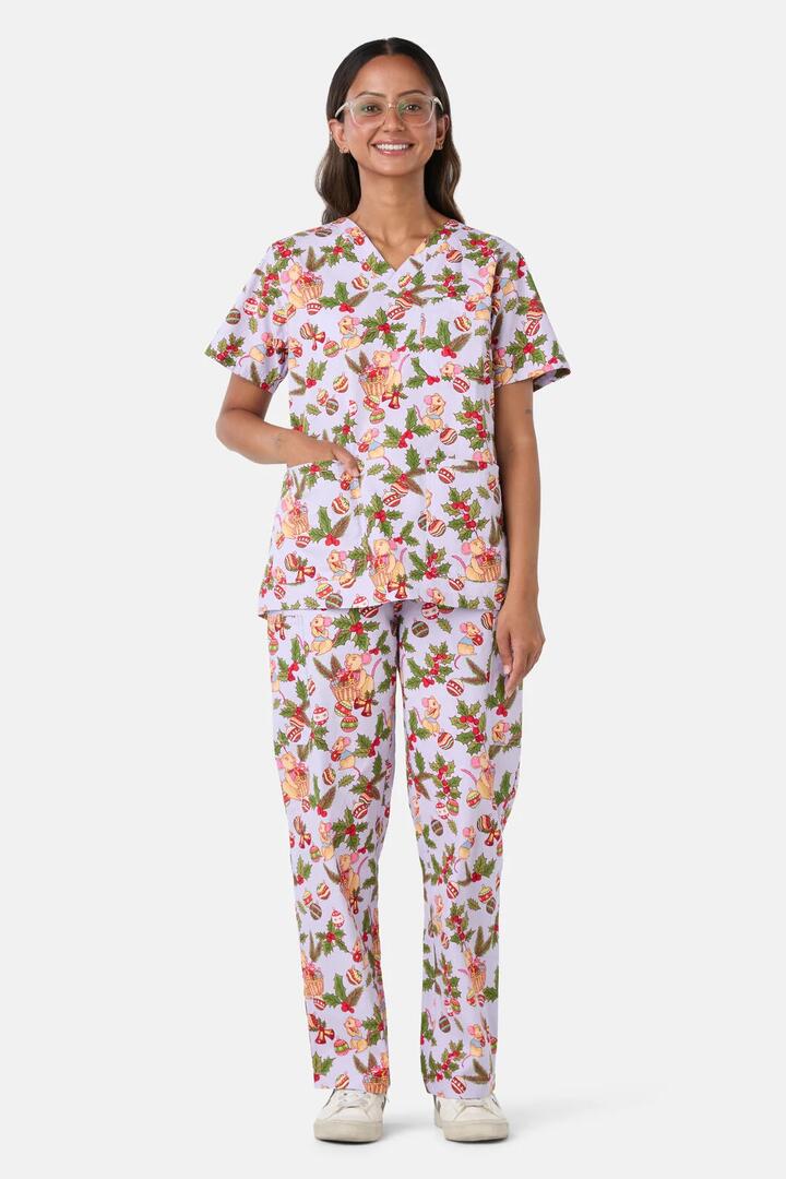 Image of a model wearing Uniforms & Workwear. Product name - Festive Mice Scrub Set in Lilac colour by brand - Scrubs With Love