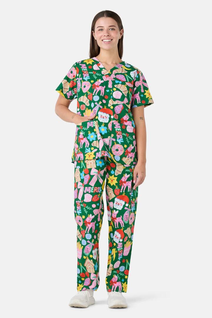 Image of a model wearing Uniforms & Workwear. Product name - Merry & Bright Scrub Set in Green colour by brand - Scrubs With Love
