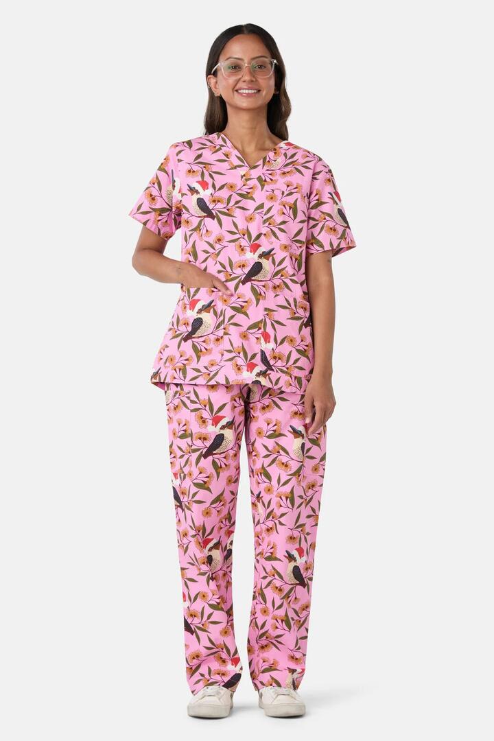 Image of a model wearing Uniforms & Workwear. Product name - Christmas Kookaburra Scrub Set in Pink colour by brand - Scrubs With Love