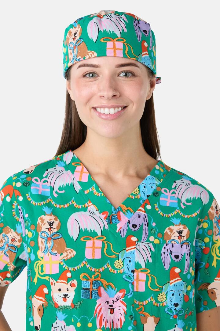 Image of a model wearing Uniforms & Workwear. Product name - Santa Paws Scrub Hat in Green colour by brand - Gorman