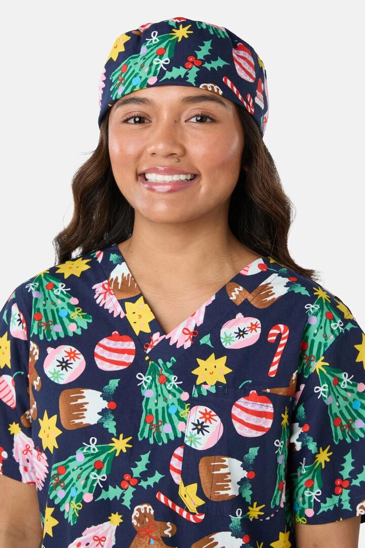 Image of a model wearing Uniforms & Workwear. Product name - Santa's Sweet Treats Scrub Hat in Blue colour by brand - Gorman