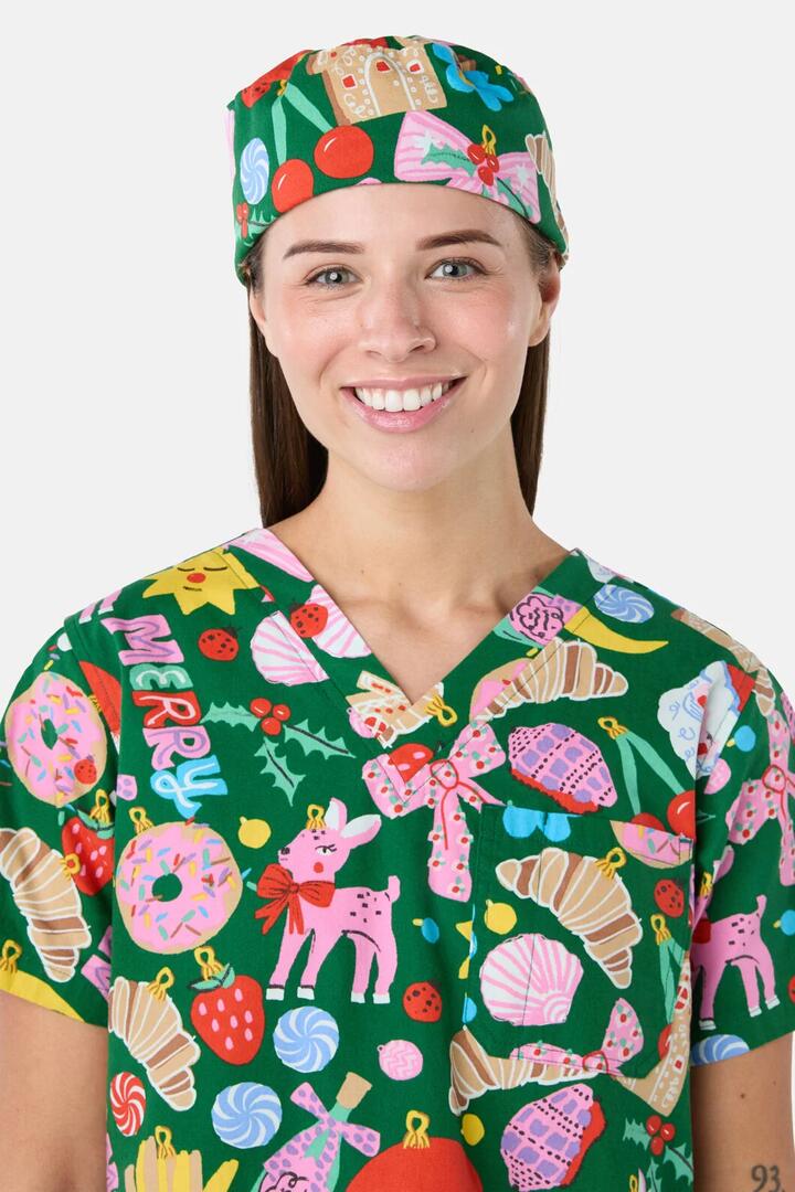 Image of a model wearing Uniforms & Workwear. Product name - Merry & Bright Scrub Hat in Green colour by brand - Gorman