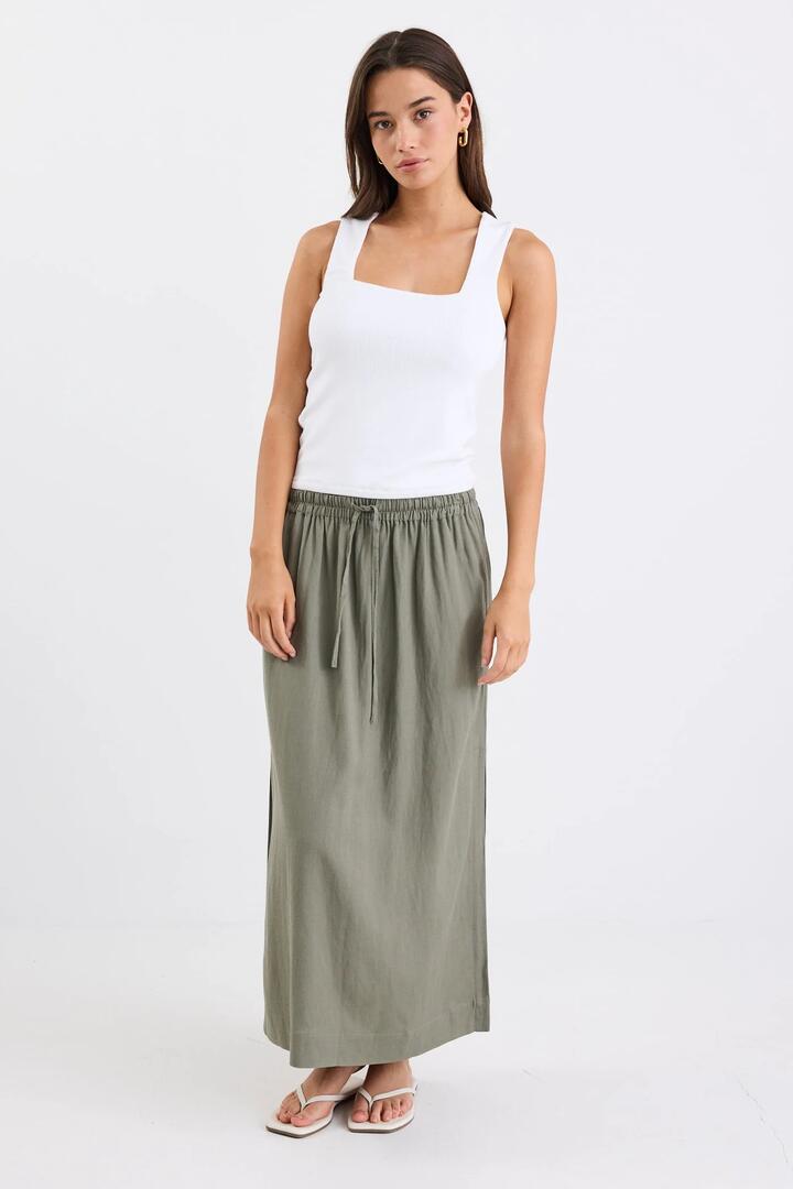 Image of a model wearing Skirts. Product name - Notion Khaki Viscose Blend Tie Waist Side Split Midi Skirt in Khaki colour by brand - Stories be Told