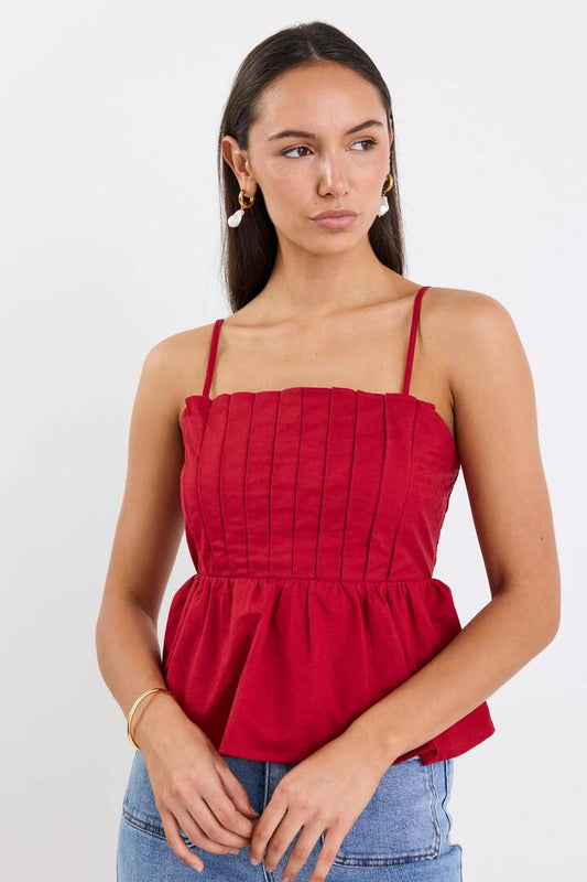 Image of a model wearing Tops. Product name - Rio Plum Pleated Bodice Strappy Peplum Top in Plum colour by brand - Among the Brave