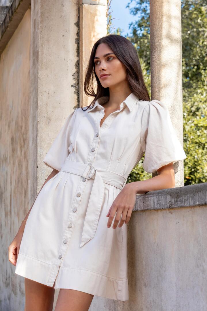 Image of Dresses. Product name - Sundown Ecru Denim Puff Sleeve Mini Shirt Dress in Ecru colour by brand - Among the Brave