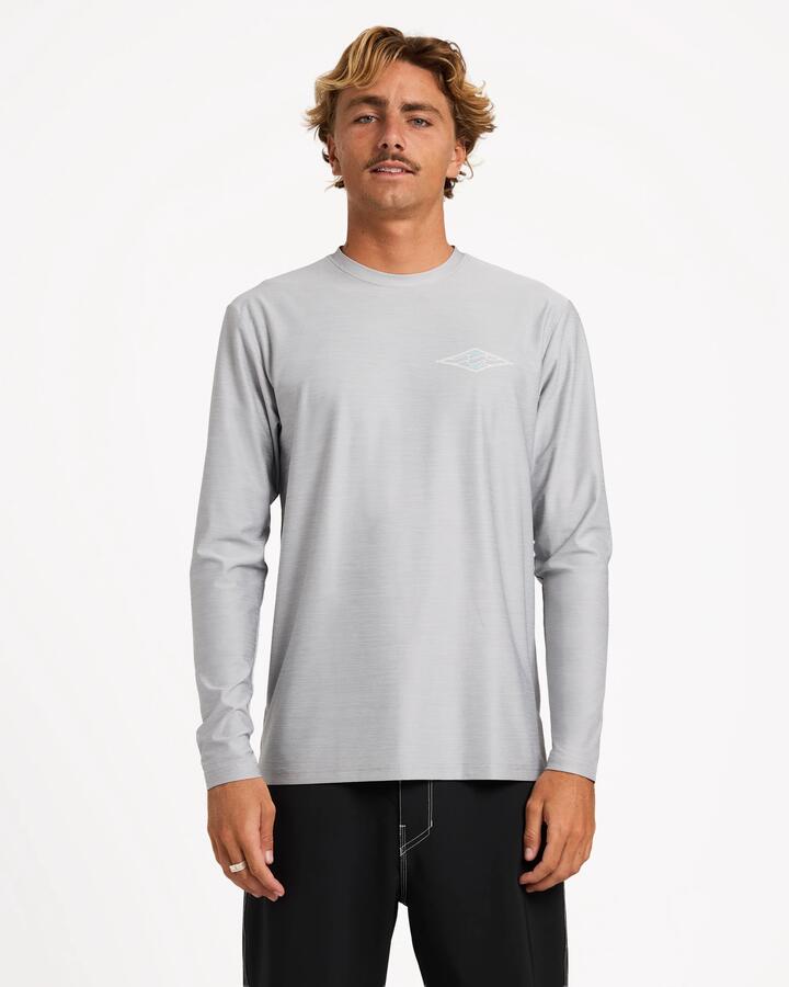 Image of a model wearing Tops. Product name - Billabong Mens Diamond Shoreline Loose Fit Long Sleeve Rash Vest Light Grey Heather in Light Grey Heather colour by brand - Billabong