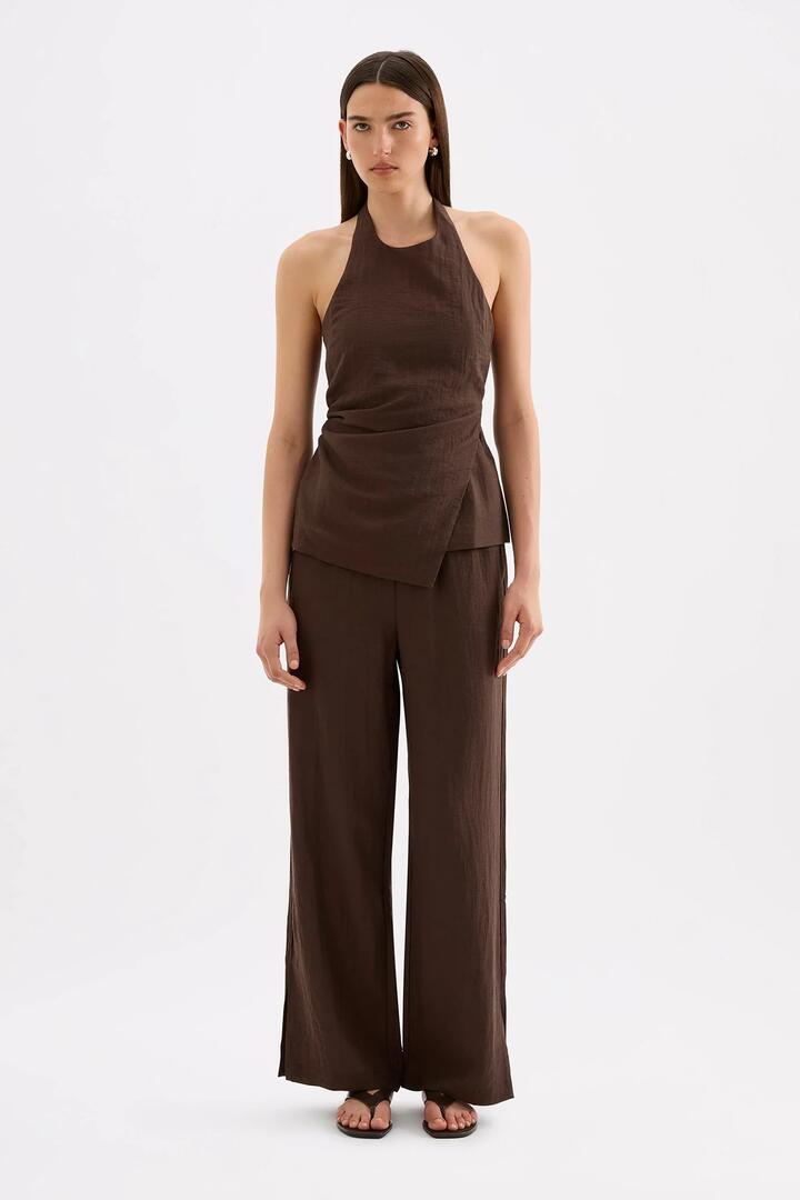 Image of a model wearing Pants. Product name - Juno Chocolate Linen Blend Pant in Chocolate colour by brand - Nude Lucy