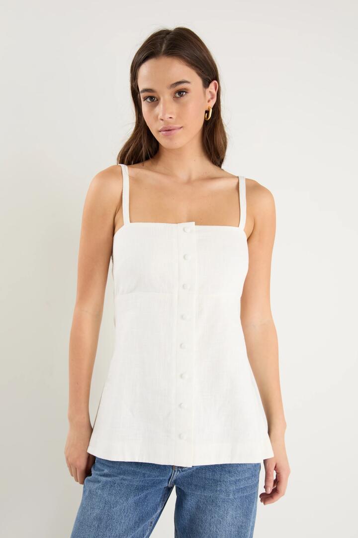 Image of a model wearing Tops. Product name - Worship Ivory Ramie Mock Button Vest in Ivory Ramie colour by brand - RE:UNION Label