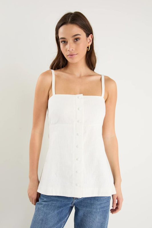 Image of a model wearing Tops. Product name - Worship Ivory Ramie Mock Button Vest in Ivory Ramie colour by brand - RE:UNION Label