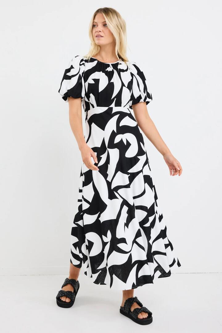 Image of Dresses. Product name - Stage Black Ivory Cut Out Print Puff Sleeve Floaty Maxi Dress in Black Ivory Cut Out Print colour by brand - Stories be Told