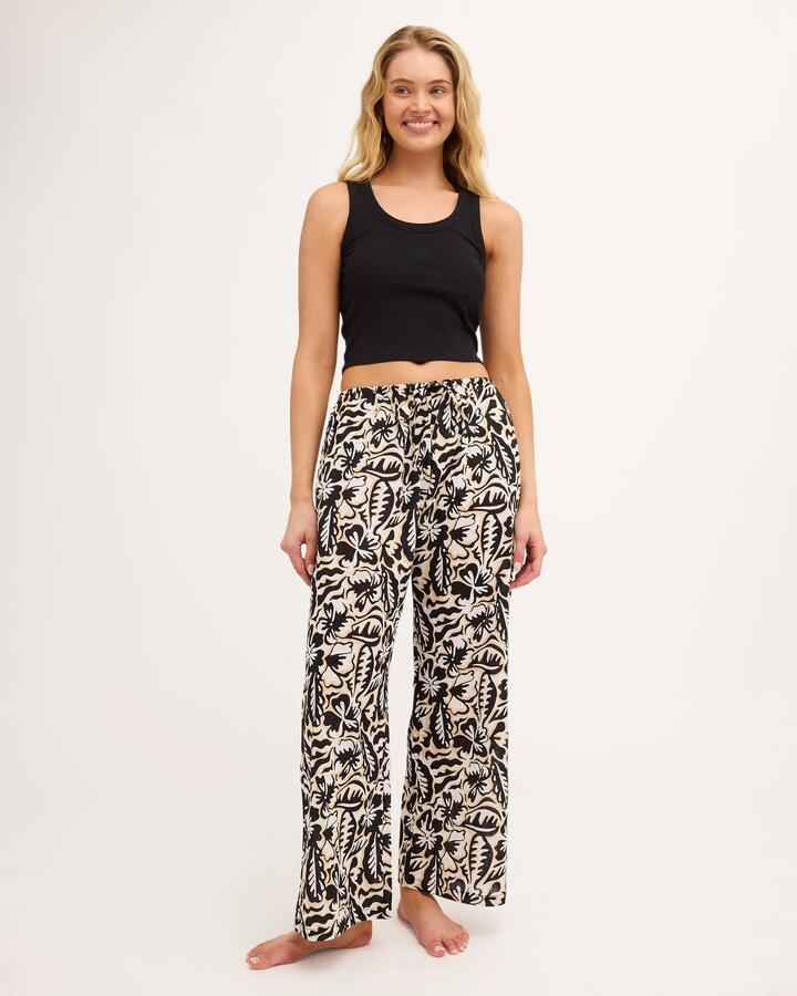 Image of a model wearing Pants. Product name - Billabong Womens Soul Dream Elastic Waist Pants Black Pebble in Black Pebble colour by brand - Billabong