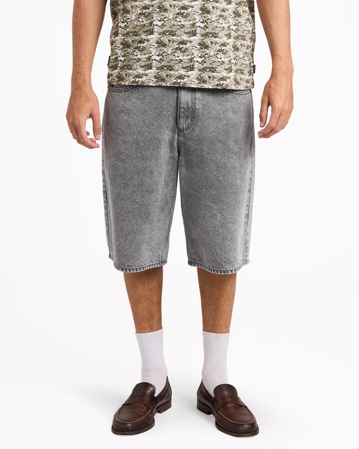 Image of a model wearing Shorts. Product name - RVCA Mens Dayshift Baggy Denim Shorts Light Grey in Light Grey colour by brand - RVCA