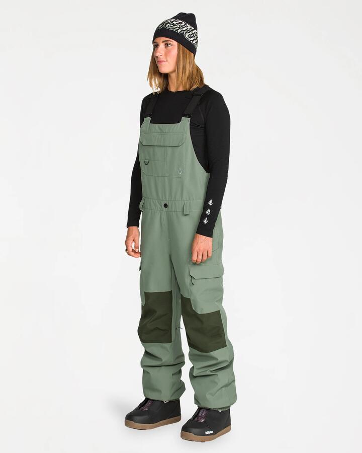 Image of a model wearing Pants. Product name - Volcom Womens Creston 3D Bib Pants Light Green in Light Green colour by brand - Volcom