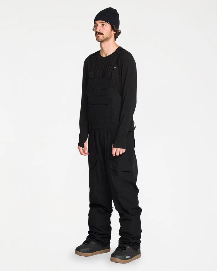 Image of a model wearing Pants. Product name - Volcom Mens Roan Bib Overall Pants Black in Black colour by brand - Volcom