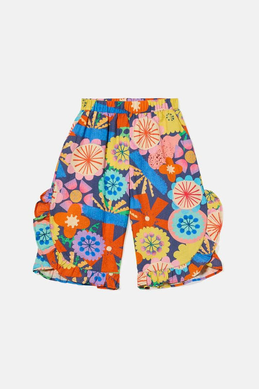 Image of a model wearing Pants. Product name - Joy Floral Kids Pant in Navy colour by brand - Gorman