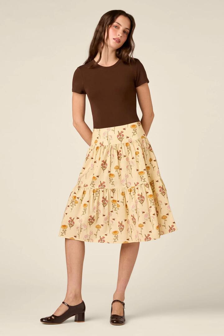 Image of a model wearing Skirts. Product name - Native Bee & Flora Skirt in Lemon colour by brand - Princess Highway