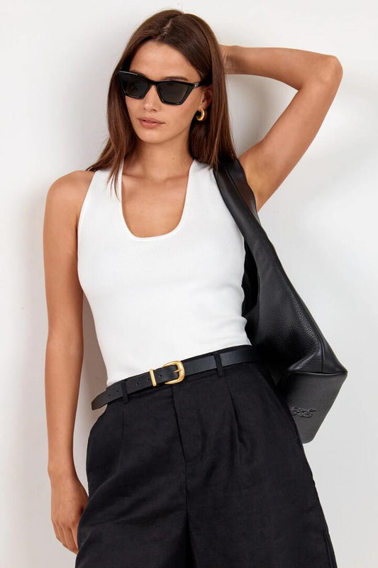 Image of a model wearing Outerwear. Product name - Ambition Ivory Racer Back Knit Top in Ivory colour by brand - Among the Brave