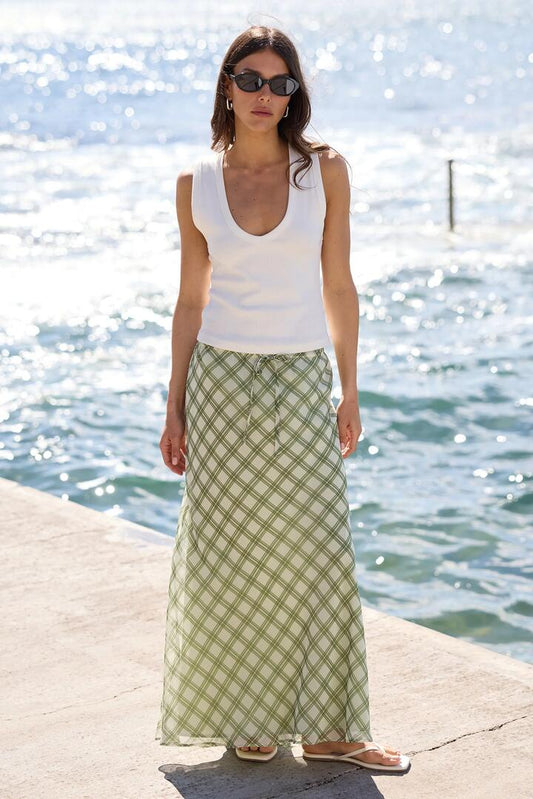 Image of a model wearing Skirts. Product name - Drifter Avocado Check Chiffon Tie Waist Bias Maxi Skirt in Avocado Check Chiffon colour by brand - Ivy + Jack