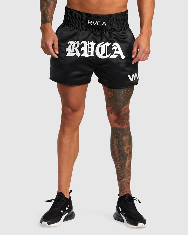 Image of a model wearing Shorts. Product name - Rvca Mens Muay Thai Mod 15" Training Shorts Black in Black colour by brand - Rvca
