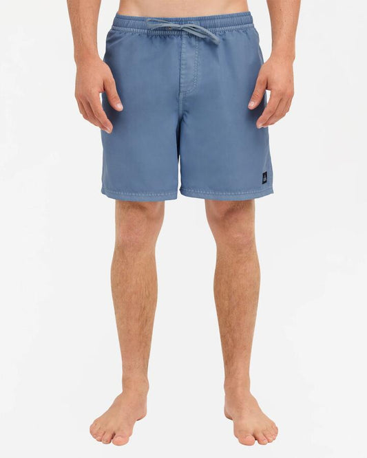 Image of a model wearing Shorts. Product name - Quiksilver Mens Everyday Surfwash 17" Volley Shorts Star Sapphire in Star Sapphire colour by brand - Quiksilver
