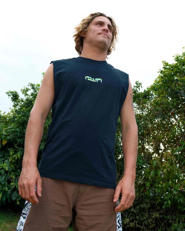 Image of a model wearing Tops. Product name - Volcom Mens Desto Muscle Black in Black colour by brand - Volcom