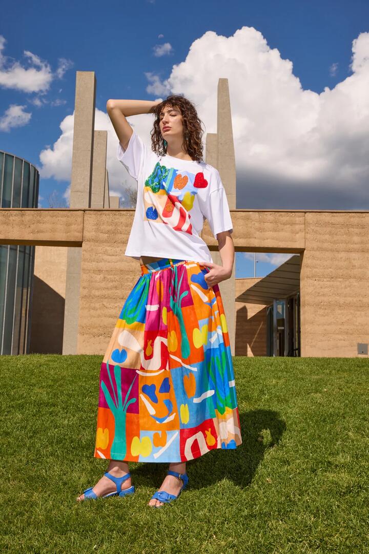 Image of a model wearing Skirts. Product name - Farmers Market Midi Skirt in Print colour by brand - Gorman