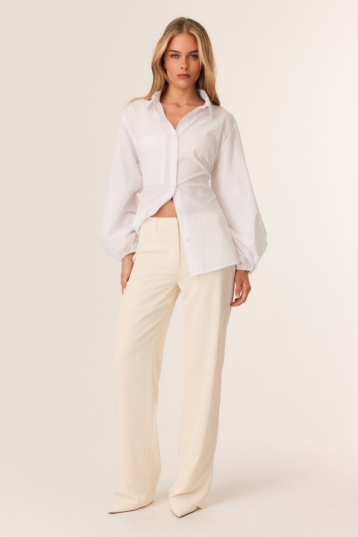 Image of a model wearing Pants. Productname: SNDYS CHASE PANTS in Off White colour by brand - SNDYS