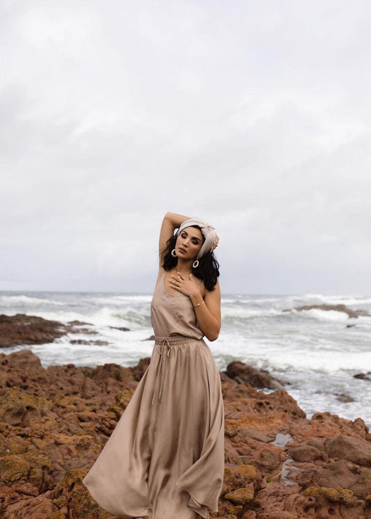 Image of a model wearing Skirts. Product name - Aster Silk Maxi Skirt Bronze in Bronze colour by brand - Lou Lou