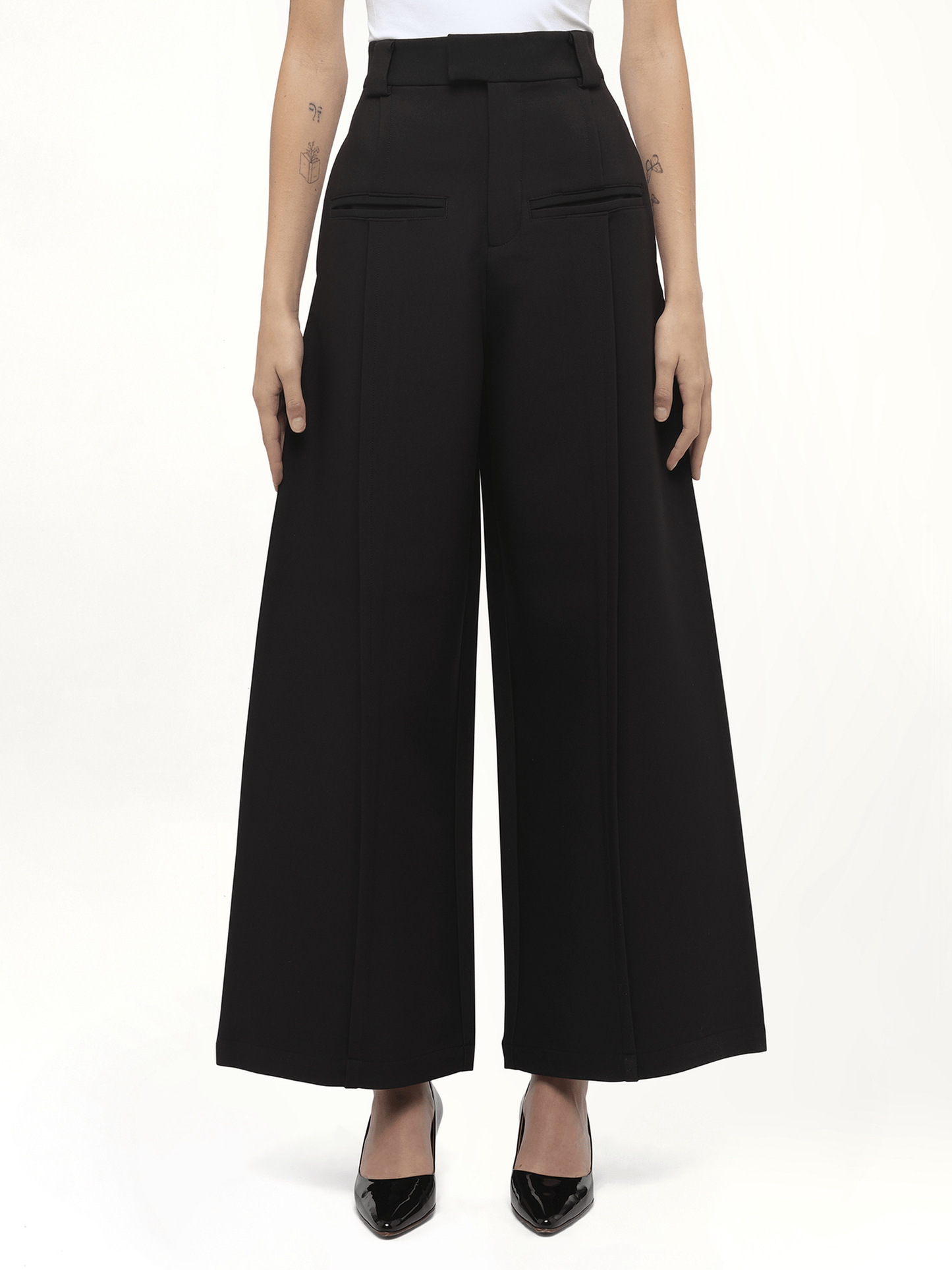 Image of a model wearing Pants. Product name - Hand in Black colour by brand - FAX COPY EXPRESS