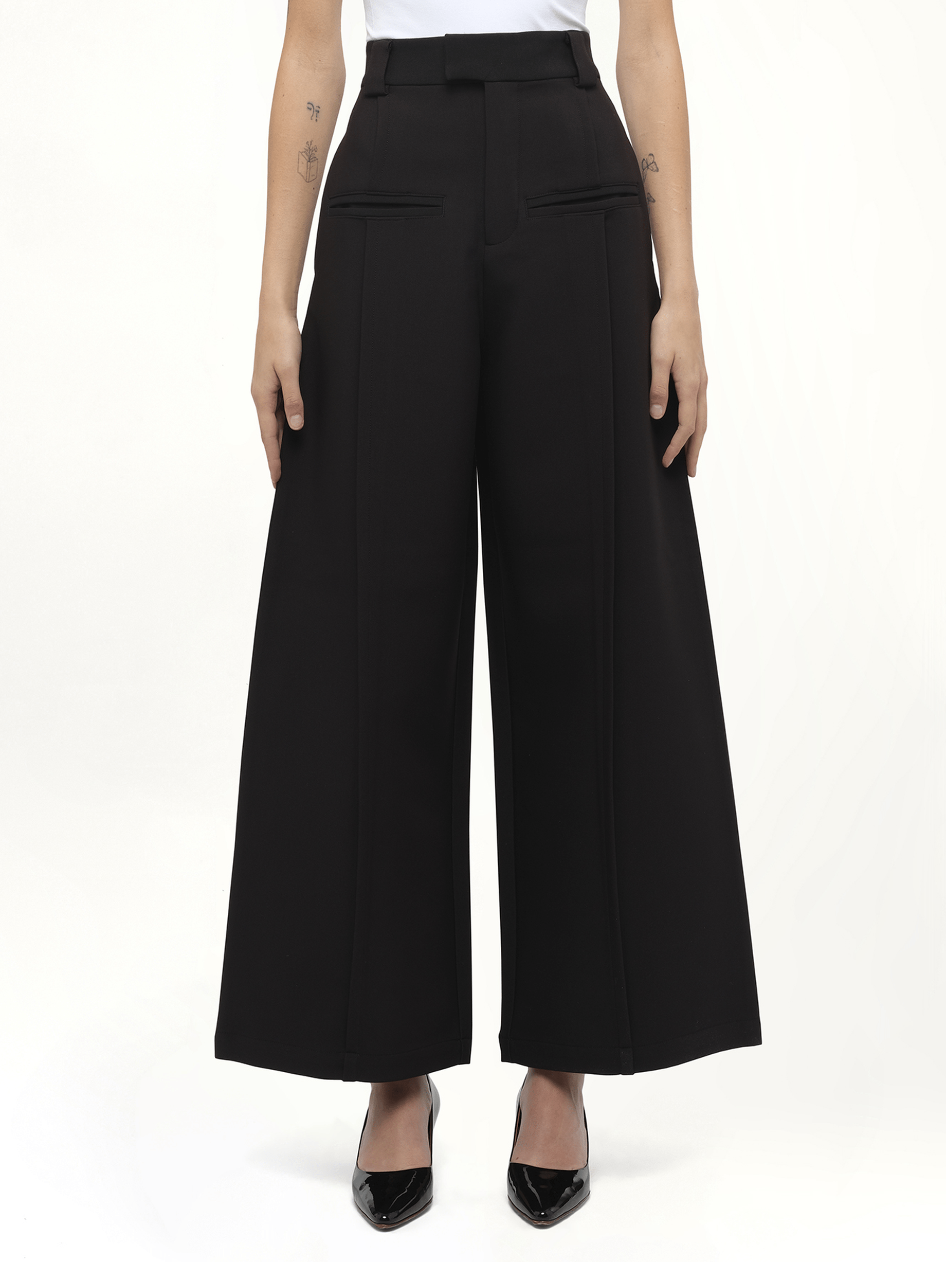 Image of a model wearing Pants. Product name - Hand in Black colour by brand - FAX COPY EXPRESS