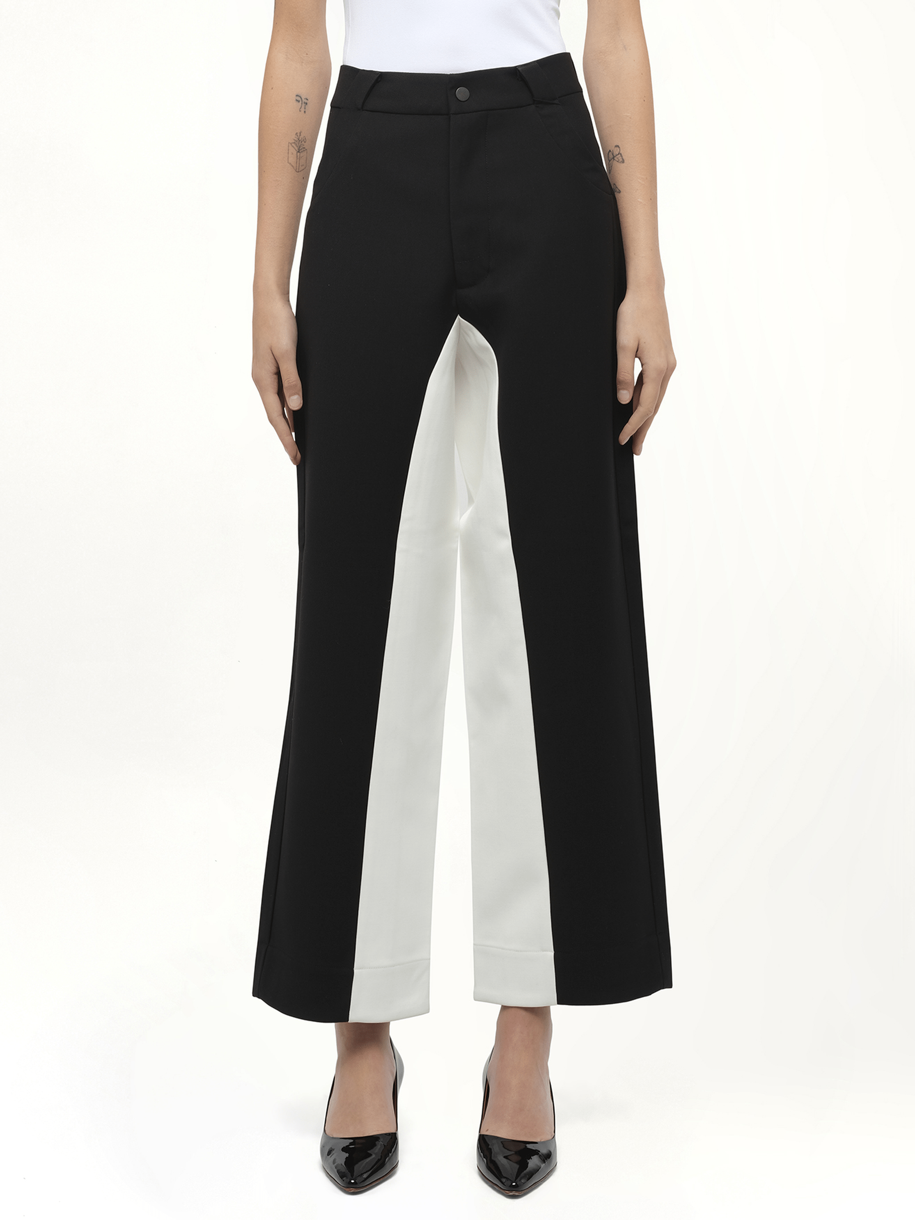 Image of a model wearing Pants. Product name - Black & White Stitched Suit Pants in Black colour by brand - FAX COPY EXPRESS