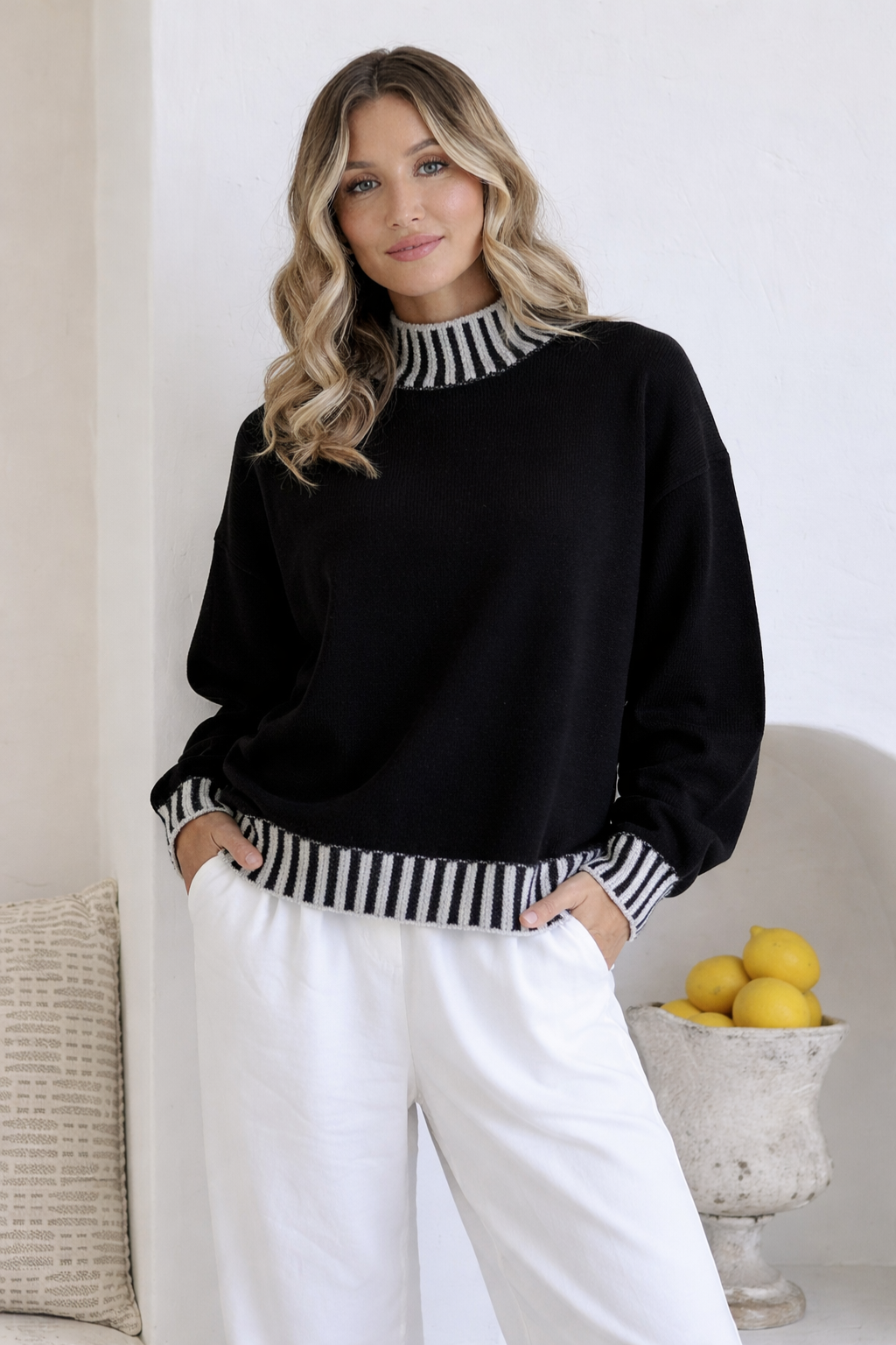 Image of a model wearing Outerwear. Productname: Mara Blanket Stitch Knit - in Black/Latte colour by brand - 132 Fashion